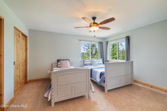 735 S Bushwacker Rd, Coeur Dalene, ID 83814 - bedroom with light colored carpet, a ceiling fan, baseboards, and a closet