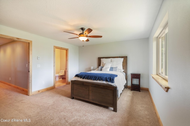 735 S Bushwacker Rd, Coeur Dalene, ID 83814 - carpeted bedroom featuring baseboards, ceiling fan, and ensuite bath