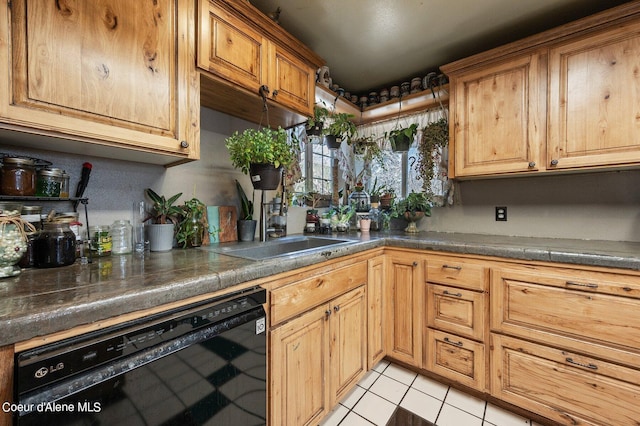 kitchen with light tile patterned floors and black dishwasher