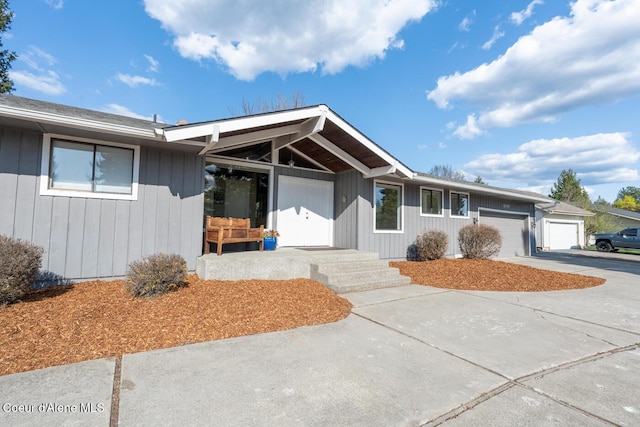 10792 N Magic Ct, Hayden, ID 83835 - ranch-style house featuring an attached garage, driveway, and a porch