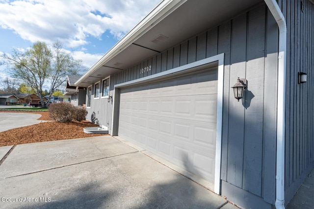 10792 N Magic Ct, Hayden, ID 83835 - view of property exterior featuring a garage and driveway