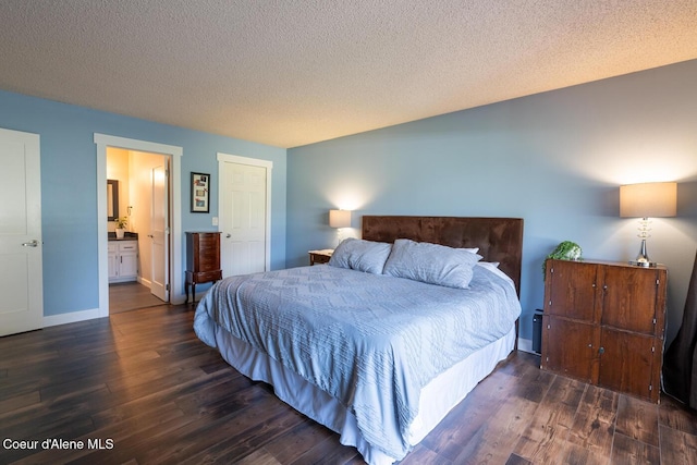 10792 N Magic Ct, Hayden, ID 83835 - bedroom featuring dark wood-style floors, a textured ceiling, baseboards, and ensuite bathroom