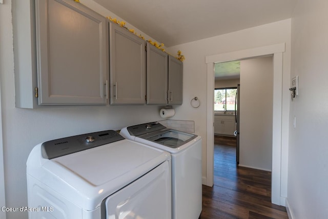 10792 N Magic Ct, Hayden, ID 83835 - laundry area with washing machine and clothes dryer, cabinet space, dark wood finished floors, and baseboards