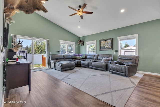 living area with wood finished floors, high vaulted ceiling, baseboards, ceiling fan, and recessed lighting