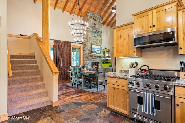 504 Hornby Pl, Dover, ID 83825 - kitchen with appliances with stainless steel finishes, wooden ceiling, a chandelier, high vaulted ceiling, and beamed ceiling