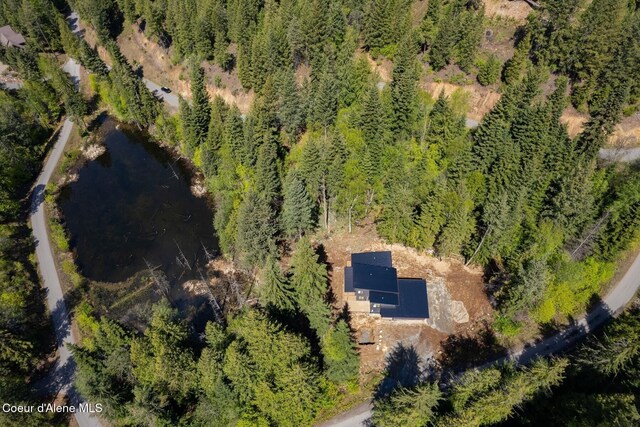 drone / aerial view with a view of trees