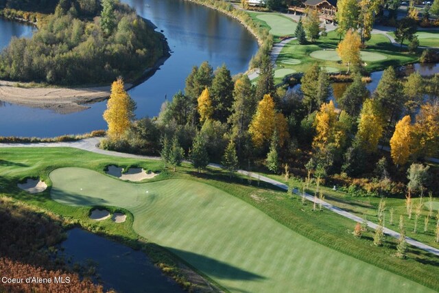 view of community with a water view and view of golf course