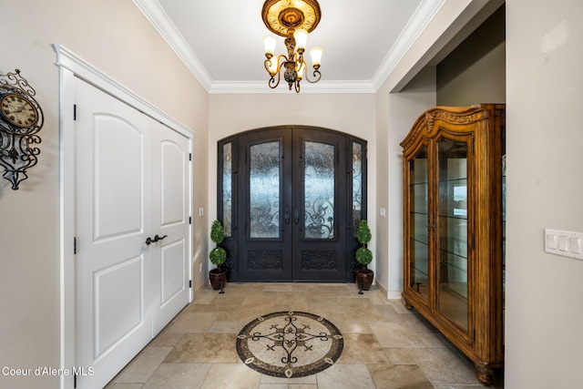 5969 W Highland Dr, Coeur Dalene, ID 83814 - entryway with crown molding, an inviting chandelier, arched walkways, french doors, and baseboards