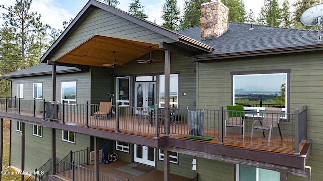 5969 W Highland Dr, Coeur Dalene, ID 83814 - back of property featuring a wooden deck, roof with shingles, french doors, a chimney, and a ceiling fan