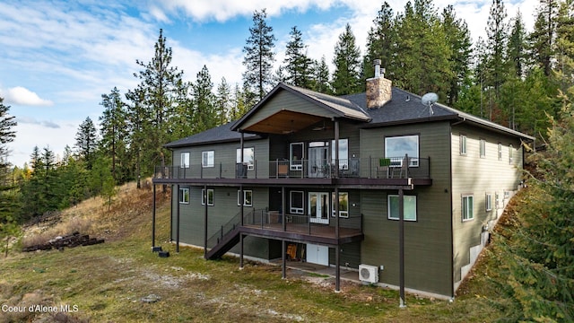 5969 W Highland Dr, Coeur Dalene, ID 83814 - rear view of house featuring ceiling fan, a balcony, a deck, a chimney, and stairway