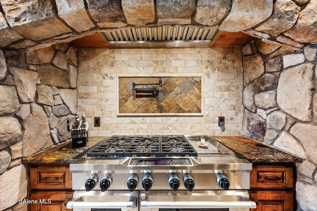 5969 W Highland Dr, Coeur Dalene, ID 83814 - kitchen featuring brown cabinets, double oven range, and dark stone countertops