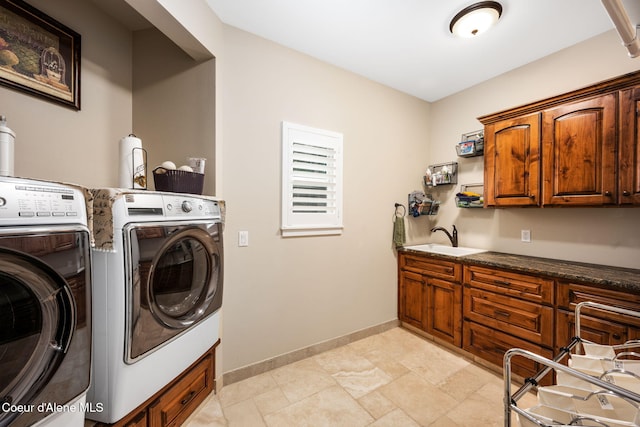 5969 W Highland Dr, Coeur Dalene, ID 83814 - washroom with a sink, baseboards, cabinet space, and washer and clothes dryer