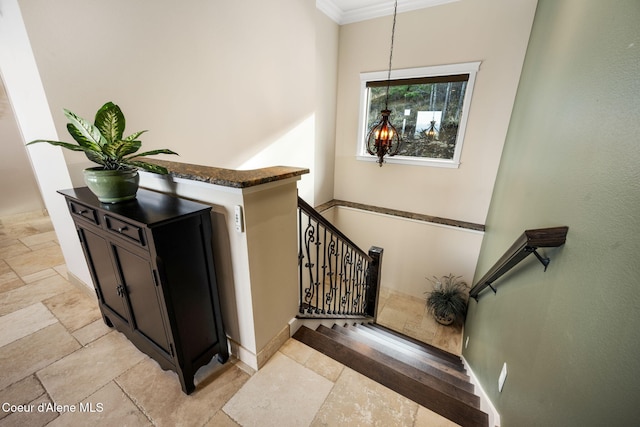 5969 W Highland Dr, Coeur Dalene, ID 83814 - staircase with baseboards, stone tile floors, and ornamental molding
