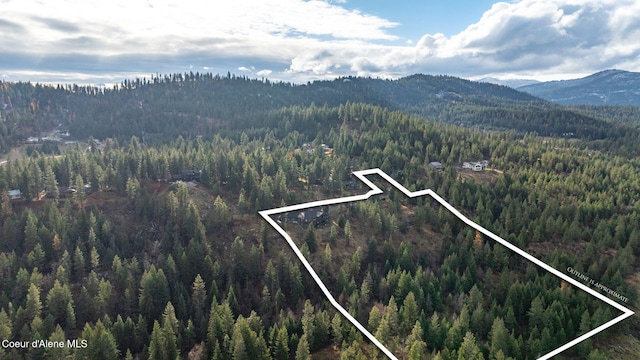 5969 W Highland Dr, Coeur Dalene, ID 83814 - aerial view featuring a wooded view and a mountain view