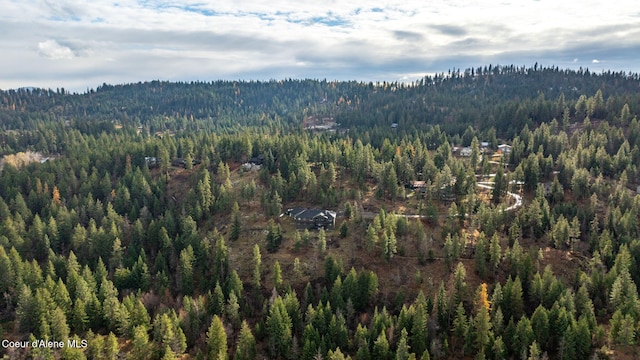 5969 W Highland Dr, Coeur Dalene, ID 83814 - birds eye view of property featuring a wooded view