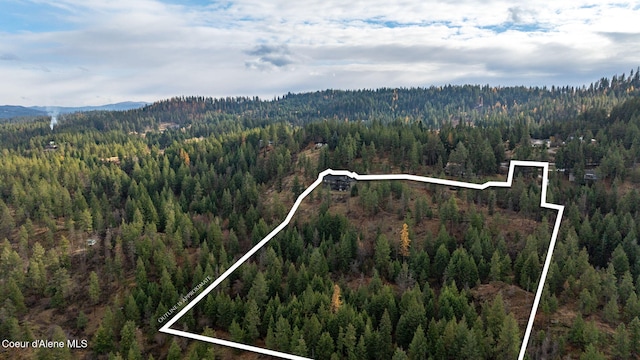 5969 W Highland Dr, Coeur Dalene, ID 83814 - birds eye view of property featuring a mountain view and a wooded view