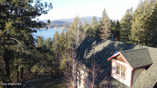 314 Overlake View Rd, Cocolalla, ID 83813 - exterior space with a wooded view, roof with shingles, and a water and mountain view