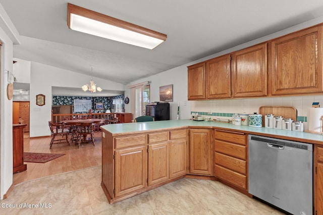 404 W 18th Ave, Post Falls, ID 83854 - kitchen featuring lofted ceiling, dishwasher, a peninsula, a chandelier, and light countertops