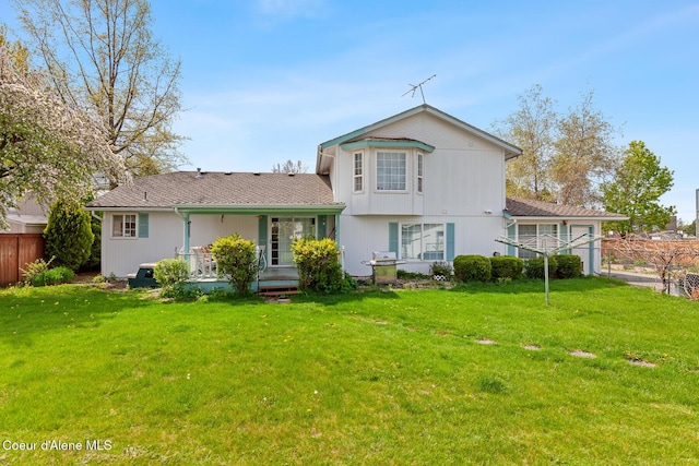 404 W 18th Ave, Post Falls, ID 83854 - rear view of property with a yard and fence