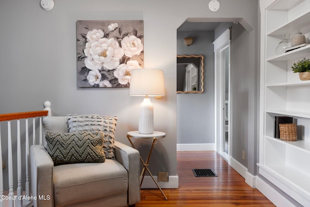 723 Forest Ave, Sandpoint, ID 83864 - sitting room featuring wood finished floors, built in features, and baseboards