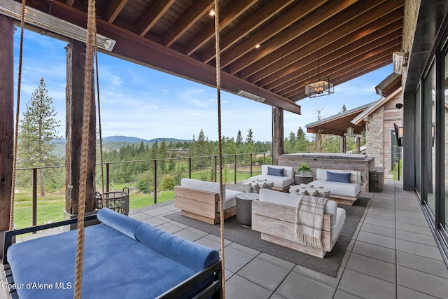 6869 S Gozzer Rd Unit C201, Harrison, ID 83833 - view of patio / terrace with a mountain view and an outdoor hangout area