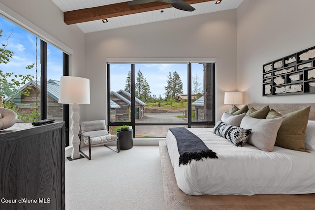 6869 S Gozzer Rd Unit C201, Harrison, ID 83833 - bedroom featuring wooden ceiling with exposed beams, high vaulted ceiling, and ceiling fan