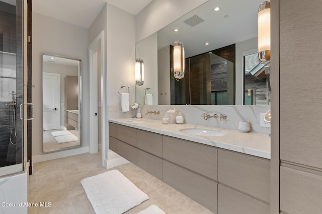 6869 S Gozzer Rd Unit C201, Harrison, ID 83833 - full bathroom featuring double vanity, tile patterned floors, and a shower stall