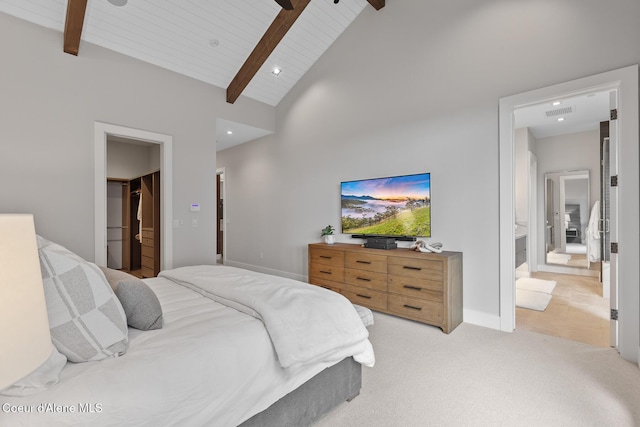 6869 S Gozzer Rd Unit C201, Harrison, ID 83833 - bedroom featuring wooden ceiling with exposed beams, light carpet, high vaulted ceiling, a spacious closet, and a ceiling fan