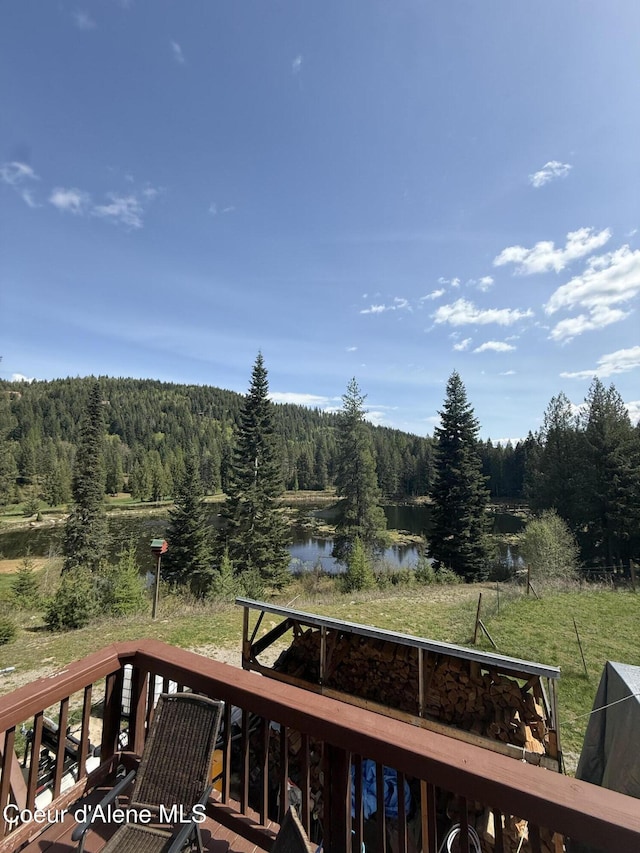 1959 Thimbleberry Ln, Sandpoint, ID 83864 - wooden terrace featuring a water view and a forest view