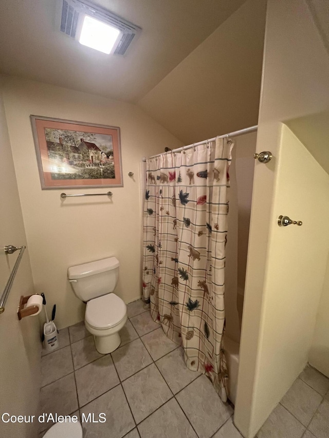 1959 Thimbleberry Ln, Sandpoint, ID 83864 - bathroom featuring tile patterned floors, toilet, lofted ceiling, and shower / bath combination with curtain