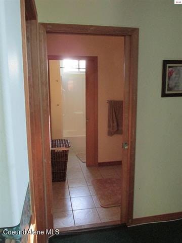 1959 Thimbleberry Ln, Sandpoint, ID 83864 - corridor featuring baseboards and light tile patterned floors