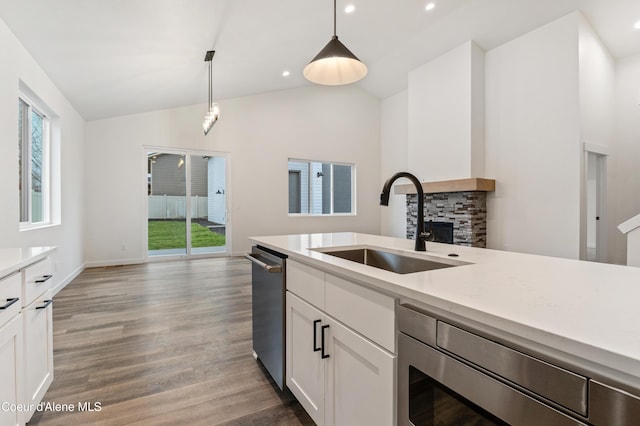 6696 Portrush Dr, Rathdrum, ID 83858 - kitchen with a sink, a wealth of natural light, and light countertops