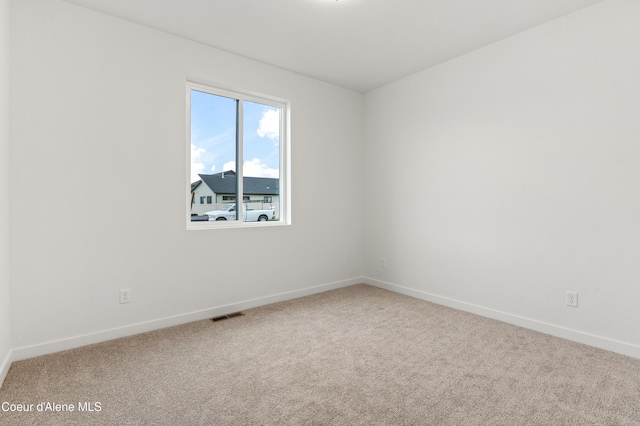 6696 Portrush Dr, Rathdrum, ID 83858 - empty room with visible vents, carpet flooring, and baseboards