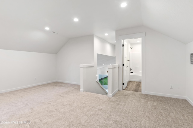 6696 Portrush Dr, Rathdrum, ID 83858 - additional living space featuring carpet floors, baseboards, recessed lighting, and lofted ceiling