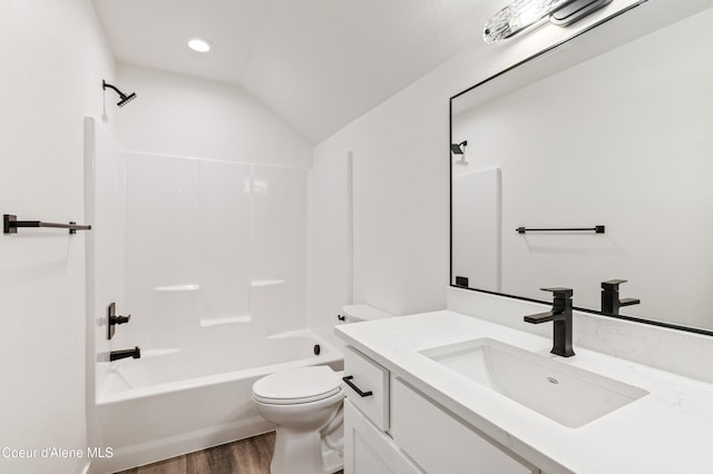 6696 Portrush Dr, Rathdrum, ID 83858 - bathroom featuring vanity, shower / bathtub combination, lofted ceiling, wood finished floors, and toilet