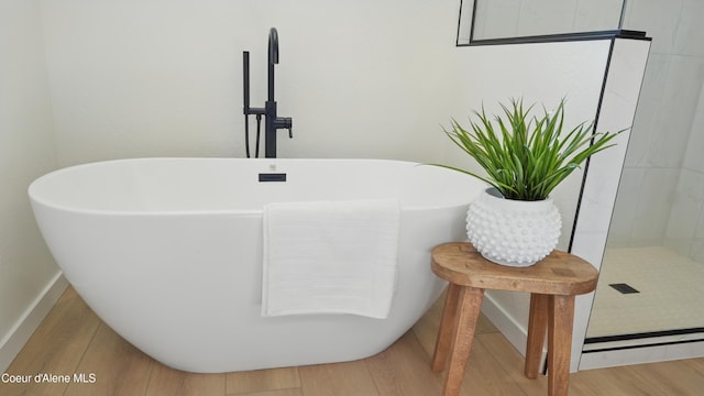 6696 Portrush Dr, Rathdrum, ID 83858 - bathroom view of a freestanding bath and wood finished floors