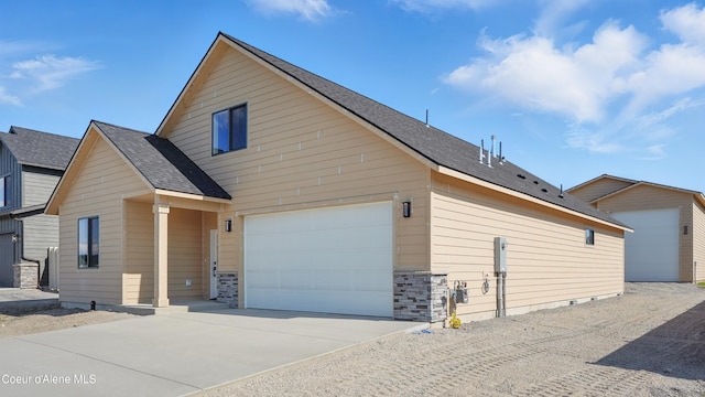6696 Portrush Dr, Rathdrum, ID 83858 - view of front of house with driveway and roof with shingles