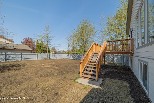 7435 N Cornwall St, Coeur Dalene, ID 83815 - view of yard featuring a fenced backyard, stairs, and a deck