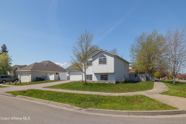 7435 N Cornwall St, Coeur Dalene, ID 83815 - view of front of home with fence, a garage, a front lawn, and concrete driveway