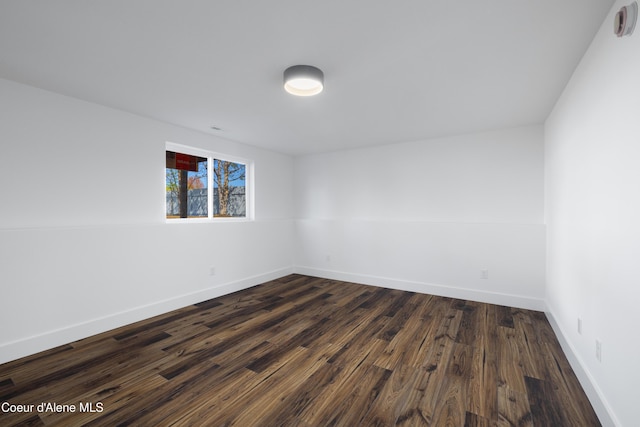 7435 N Cornwall St, Coeur Dalene, ID 83815 - unfurnished room featuring dark wood finished floors and baseboards