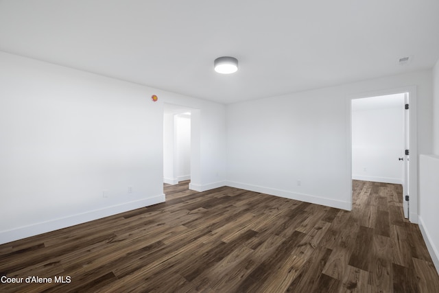 7435 N Cornwall St, Coeur Dalene, ID 83815 - empty room featuring baseboards and dark wood finished floors