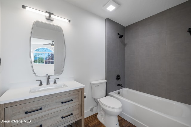 7435 N Cornwall St, Coeur Dalene, ID 83815 - full bath with bathtub / shower combination, toilet, wood finished floors, and vanity