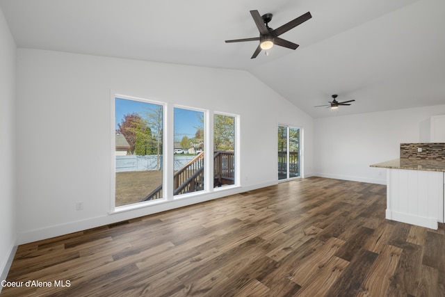 7435 N Cornwall St, Coeur Dalene, ID 83815 - unfurnished living room featuring lofted ceiling, dark wood-style flooring, baseboards, and ceiling fan