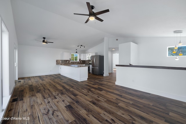 7435 N Cornwall St, Coeur Dalene, ID 83815 - unfurnished living room with lofted ceiling, baseboards, a ceiling fan, and dark wood finished floors
