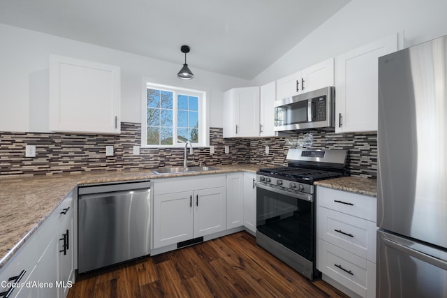 7435 N Cornwall St, Coeur Dalene, ID 83815 - kitchen featuring lofted ceiling, a sink, dark wood-type flooring, backsplash, and stainless steel appliances