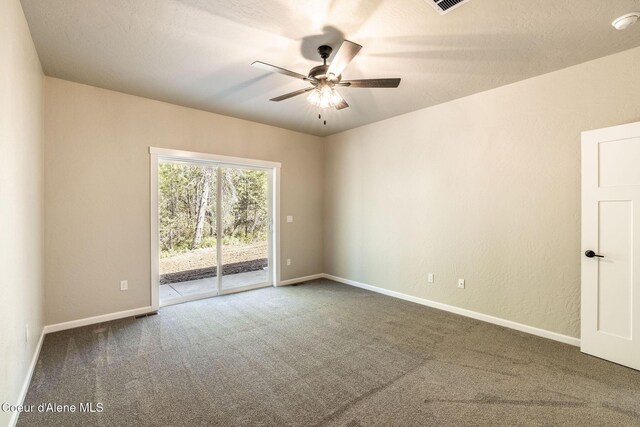 7587 E Duke Ln, Athol, ID 83801 - spare room featuring carpet floors, ceiling fan, and baseboards