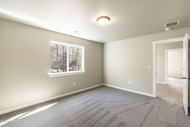 7587 E Duke Ln, Athol, ID 83801 - carpeted empty room with a textured ceiling, baseboards, and visible vents