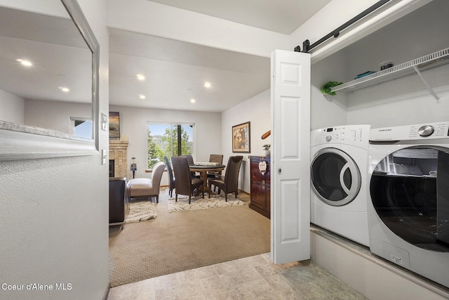 19820 S Alcan Rd, Coeur Dalene, ID 83814 - clothes washing area with washer and dryer, recessed lighting, and a barn door