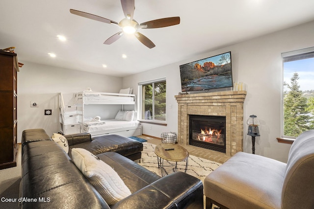 19820 S Alcan Rd, Coeur Dalene, ID 83814 - living area with ceiling fan, a fireplace, and recessed lighting
