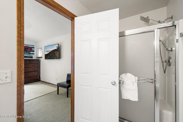 19820 S Alcan Rd, Coeur Dalene, ID 83814 - full bathroom featuring a shower with shower door, vaulted ceiling, and baseboards